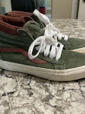 Green high top vans off the wall